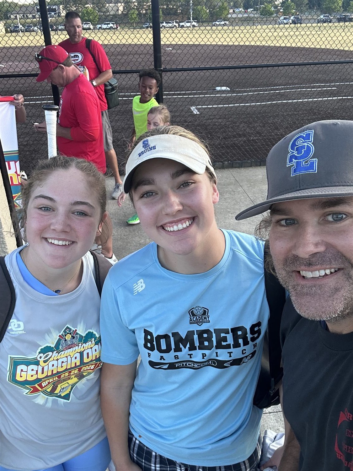 Kyle Koester with student-athletes at a Cherokee County softball tournament