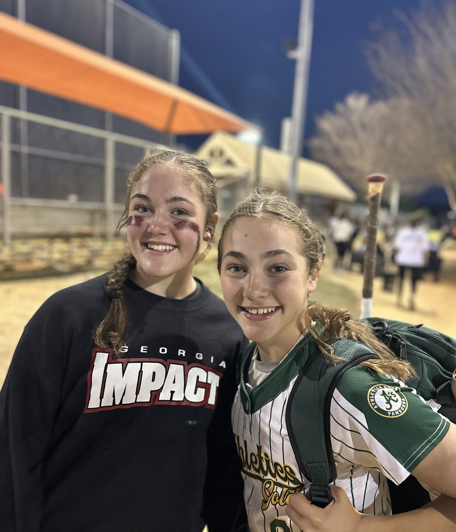 Two young softball players after a night game